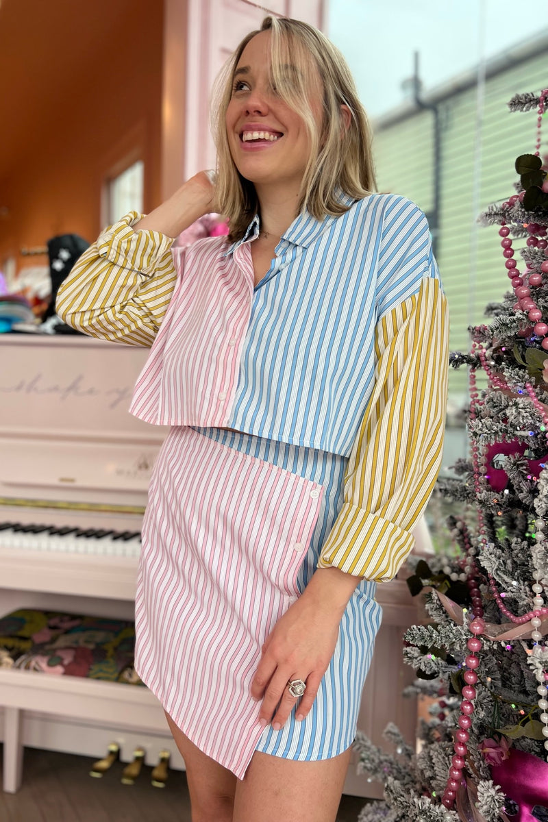 A mini skirt perfectly suited for stoopin' at the snowball stand this spring! With an asymmetrical, flattering overlap in the front and a totally on trend colorblock, this lightweight beauty perfectly complements its matching buttondown or provides the perfect feminine, flirty balance to any of your graphic tees.