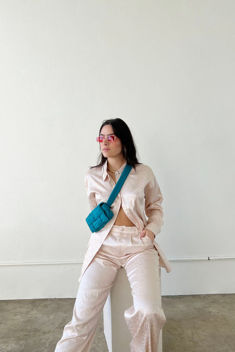 These jacquard satin pants are giving us all the effortlessly cool vibes that you find along the West Coast. With a classic, high waisted, straight leg fit and flattering trouser pleats, these beauties can truly do it all. Pair them with our West Coast Jacquard Satin Button Down for a special event or to wear to the office.