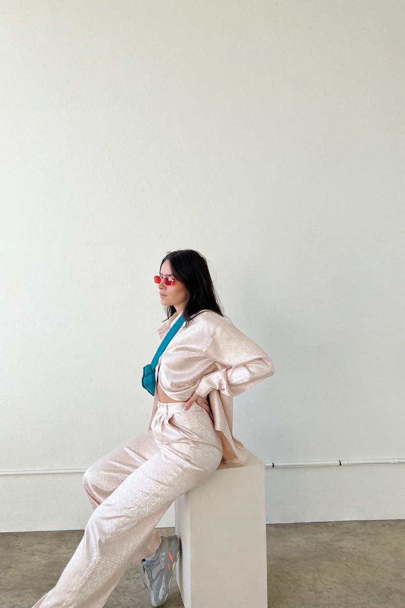 These jacquard satin pants are giving us all the effortlessly cool vibes that you find along the West Coast. With a classic, high waisted, straight leg fit and flattering trouser pleats, these beauties can truly do it all. Pair them with our West Coast Jacquard Satin Button Down for a special event or to wear to the office.