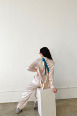 Throw on our stunning jacquard satin button down and watch yourself be instantly transported to the effortlessly cool vibes of the West Coast! Classic satin button down blouse with a touch of sheen meets totally on trend, subtle jacquard print that's perfect for the office or a special event. Complete the set with our West Coast Jacquard Satin Pants.