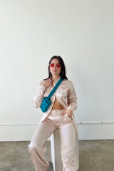 Throw on our stunning jacquard satin button down and watch yourself be instantly transported to the effortlessly cool vibes of the West Coast! Classic satin button down blouse with a touch of sheen meets totally on trend, subtle jacquard print that's perfect for the office or a special event. Complete the set with our West Coast Jacquard Satin Pants.