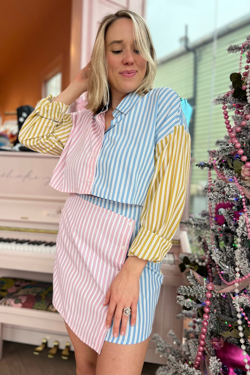 A mini skirt perfectly suited for stoopin' at the snowball stand this spring! With an asymmetrical, flattering overlap in the front and a totally on trend colorblock, this lightweight beauty perfectly complements its matching buttondown or provides the perfect feminine, flirty balance to any of your graphic tees.