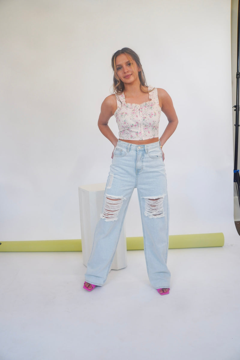 Throw me on and away you go! These wide leg distressed jeans will be by your side through it all. With their high rise, relaxed fit and distressing at the thighs, these are the perfect boyfriend jeans to accompany any of your favorite crop tops. Shown here with our Heard it through the Grape Vine Corset Top and Think Pink Mule.