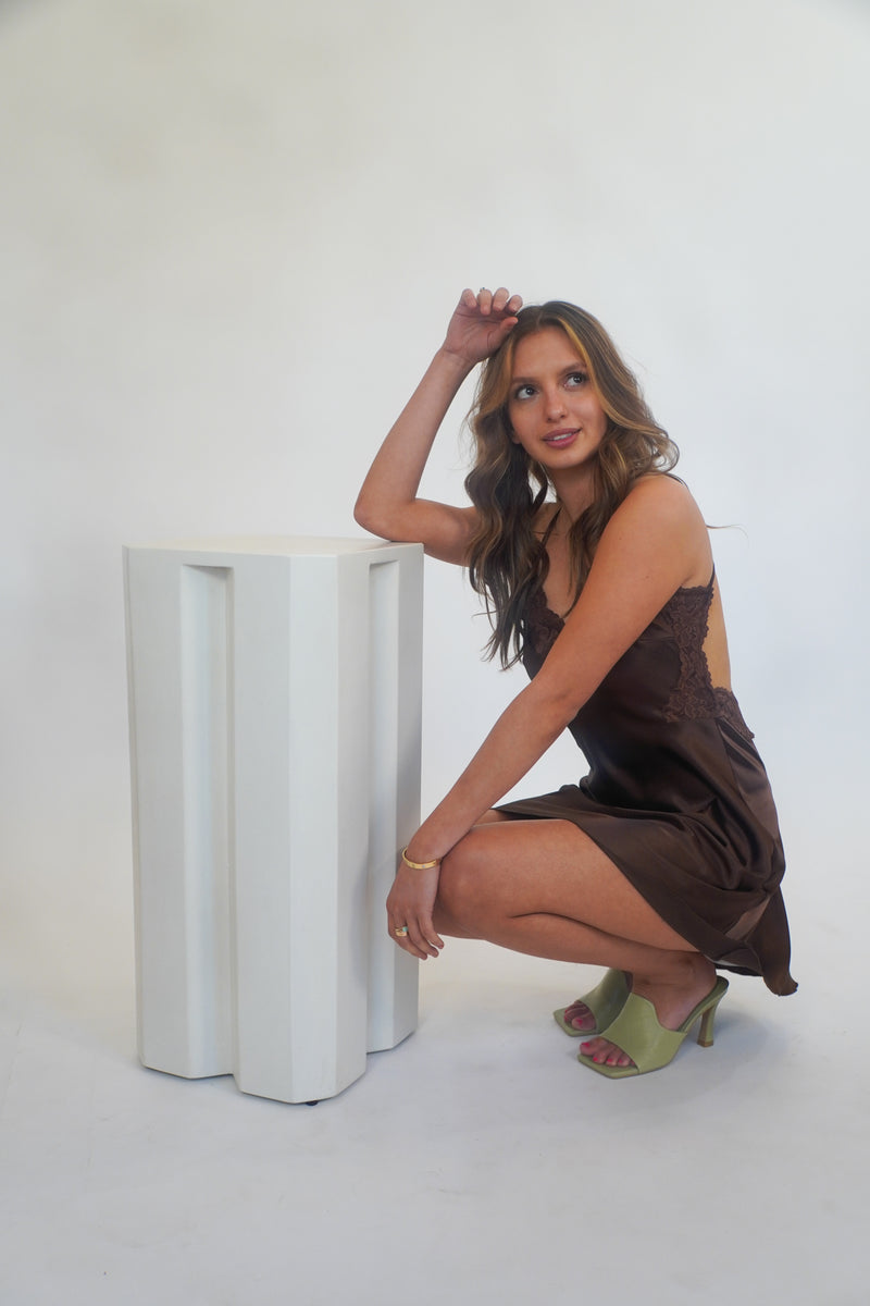 Sweet as chocolate, yet oh so sultry... this stunning silk slip dress has truly stolen our hearts. With its' classic slip dress silhouette, racerback straps and lace trim, this beauty can be dressed up for your special event, or toss it on with some sneakers and a denim jacket for date night. Our Sweet as Chocolate Silk Slip is shown here with our Fair and Square Mule.