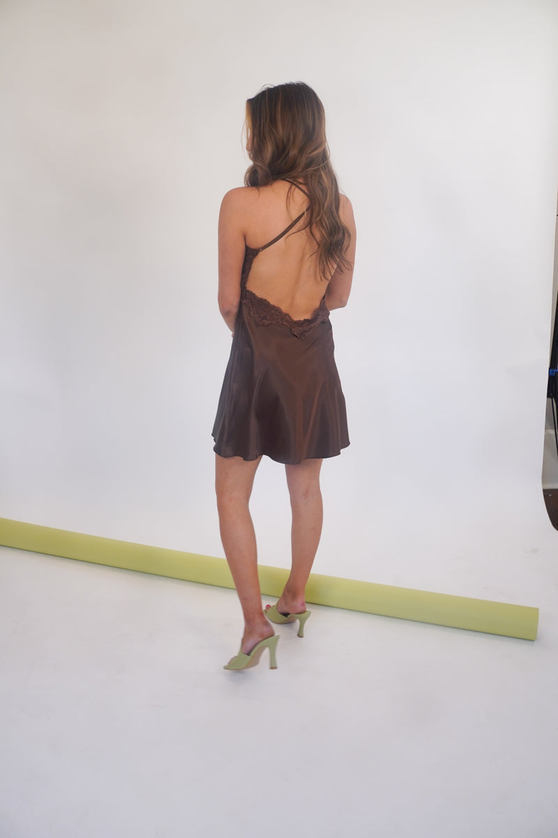 Sweet as chocolate, yet oh so sultry... this stunning silk slip dress has truly stolen our hearts. With its' classic slip dress silhouette, racerback straps and lace trim, this beauty can be dressed up for your special event, or toss it on with some sneakers and a denim jacket for date night. Our Sweet as Chocolate Silk Slip is shown here with our Fair and Square Mule.
