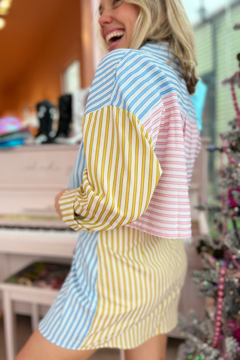 A mini skirt perfectly suited for stoopin' at the snowball stand this spring! With an asymmetrical, flattering overlap in the front and a totally on trend colorblock, this lightweight beauty perfectly complements its matching buttondown or provides the perfect feminine, flirty balance to any of your graphic tees.