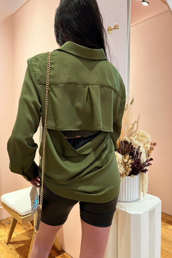So good it'll make you do a double take, our open back satin buttondown brings a layer of sophistication and class to any bottoms. Throw it on for a day in the office and be perfectly dressed all the way to happy hour. Featuring a relaxed, flowy fit, hidden button front closure and open back detail guaranteed to turn heads.