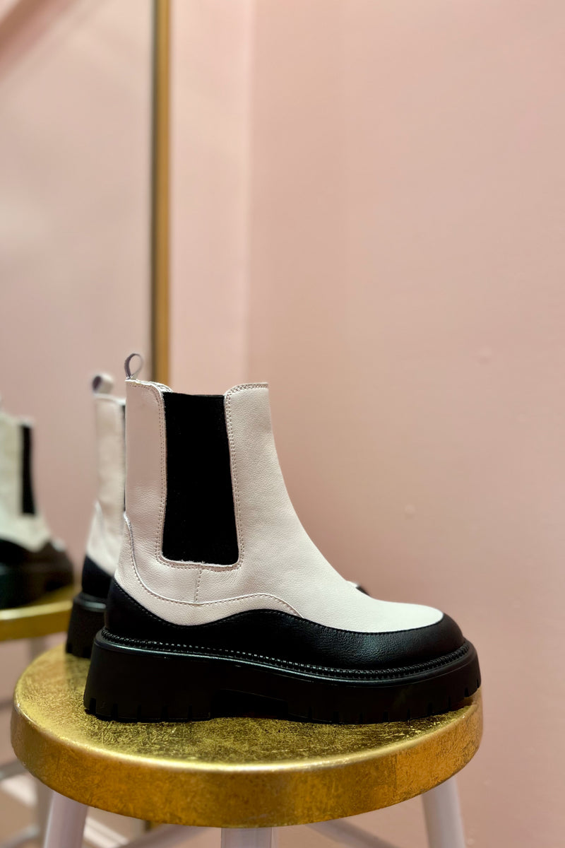  Some things aren't always black and white, but some things are! Give yourself the best of both worlds with the stunning statement Allistor Bootie ~ comfortable, durable and effortlessly cool with a classic Chelsea silhouette, chunky heel, and a totally unique black and white color-way. 