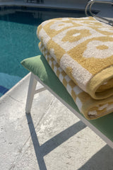 Get ready to Vacay Away and make sure you bring this precious beach towel! Featuring ultra absorbent, water wicking cotton material, a resort size and on-trend playful print, this essential vacation staple is meant to be loved for years to come.  100% Cotton Measures 70 x 140 CM Multi = floral print checkered design Check = solid checkered design