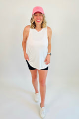 Totally raw and real, this flow tank is made for getting down to business! A curved hem and raw edges on the collar and sleeve holes make this the perfect tank to throw on for a walk or your next yoga session. Shown here with our Essentials Only Biker Short.  Runs a little big, Bonnie is 5'5" wearing size large 95% Rayon, 5% Spandex Curved hem Loose fitting and stretchy material  Raw edges at collar and sleeve holes