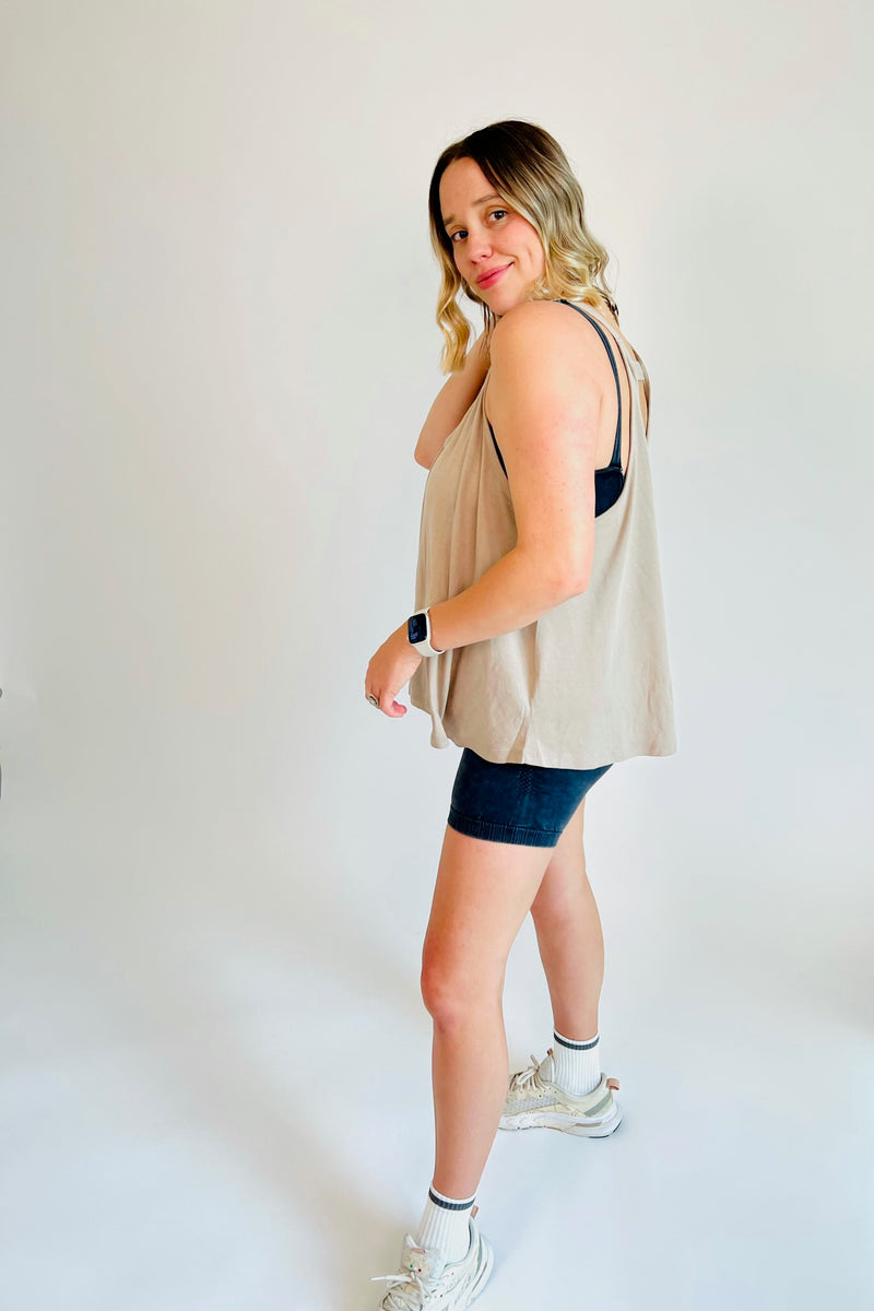 You're self made and used to working hard, and this sporty strap back tank will ensure you're effortlessly cool and put together for even the toughest of workouts! Crafted from cotton-modal-blend fabric, this loose-fitting top also features a V neckline, a seamline in the front middle, and a horizontal strap on the back. Shown here layered over our Just Breathe Seamless Onesie.