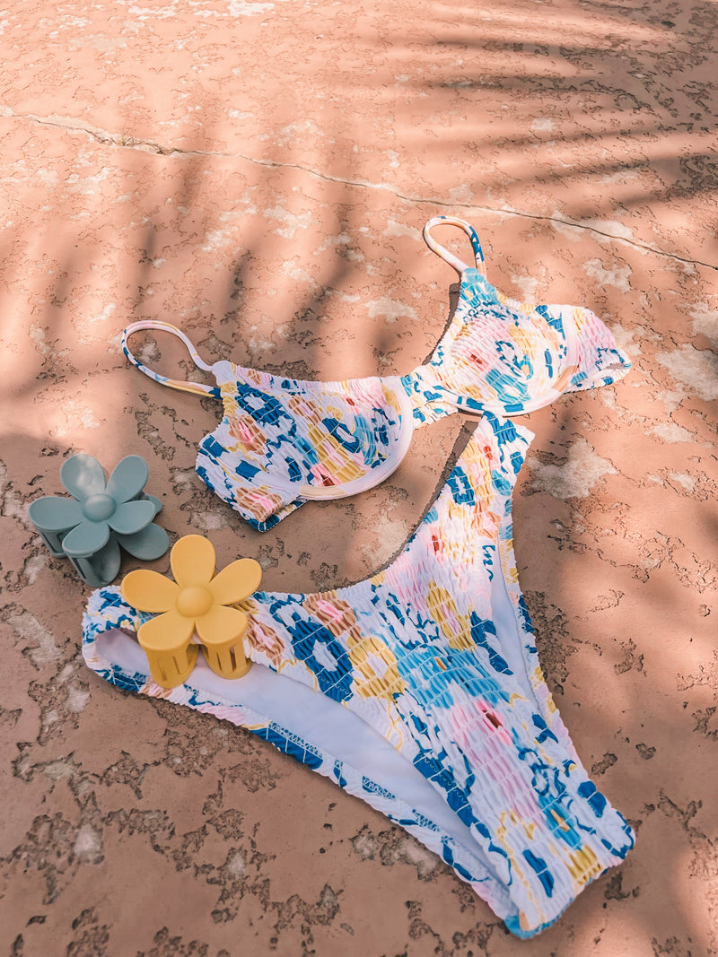 It truly doesn't get much better than our Gold Dust Ruched Bikini set... With a supportive underwire top, allover, flattering ruched fabric, and high cut, moderate coverage bottoms, this duo will perfectly hug your every curve.   Runs true to size, model wearing size small Sold as a set Ruched fabric Underwire top design, adjustable straps Removable pads High cut, moderate coverage bottom