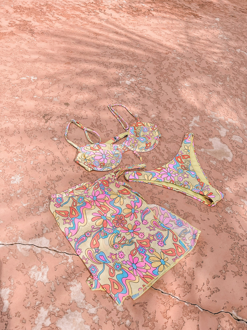 Here for making moves and getting in grooves, this bikini set lets everyone know you're all about a good time! Featuring a flattering and supportive underwire top with adjustable and removable traps and a seamless, high cut bottom, this spicy set is made for long summer days that seamlessly turn into golden hours. Pairs perfectly with our Groovy Floral So Wrong it's Right Sarong.