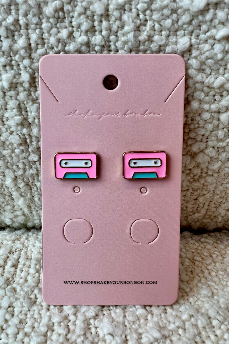 Alright, DJ... Play that song! Show your playful, music-loving side with these precious enamel radio stud earrings! A fun pop of color for every day wear and just retro enough to make you reminisce on those cassette player days.  Approx. length 0.60" Sold as a set Stud earrings