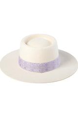 For a style statement worth making, the Lavender Lolita transforms from day to night with ease and seamlessly softens any outfit. Featuring an oval crown design, this is our best fitting boater yet. White-Ivory dipped crown boater trimmed with vintage lavender brocade ribbon. This hat is crafted from 100% Australian wool, a completely natural, renewable and biodegradable fibre.