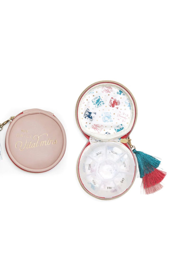 Stay organized and on track with the Vegan Leather Travel Pill Case with Tassel - "Daily Vital-Mins". This compact travel pill case keeps your medications and vitamins organized in a cute, convenient case. Featuring labels with the days of the week and a zipper closer, all your supplements and necessities are secure and neatly stored in your bag or suitcase.  7 Days of the Week Compartment Pill Box Vegan Leather Carrying Case Printed Inner Liner Metallic Zipper Closure Removable Tassel