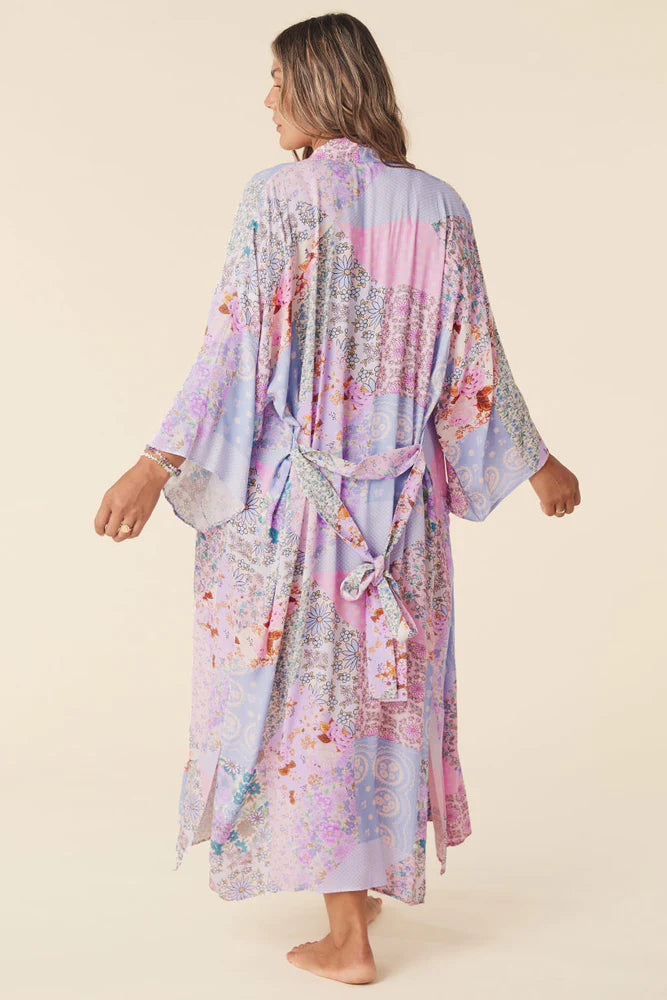 Our Cha Cha Maxi Robe from Spell is their classic Robe shape reimagined with the signature Cha Cha patchwork print in ever dreamy Jacaranda. Featuring patch pockets at the sides and a detachable waist tie, this Robe is perfect for layering over intimates, lounge wear  and swim, or to add a pop of color to your tank and denim shorts.