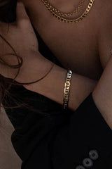 Intricate and elegant, we could not be more obsessed with this stunning Cuban Chain Bracelet! Guaranteed to be a piece you're loving for years to come.  Bold Cuban style chain bracelet Thick Gold Overlay Measures 6.5" with 1" extender chain Handmade in Costa Mesa, CA.