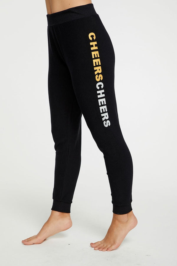 Bring four times the CHEER to your holidays this year by wearing our festive graphic pants. Pair with our matching pullover for extra festive points!  Cozy knit Color:  True black Cheers Pant Fabric Content: 46% Polyester 46% Rayon 5% Spandex Model is 5'7" and wearing a size small Imported