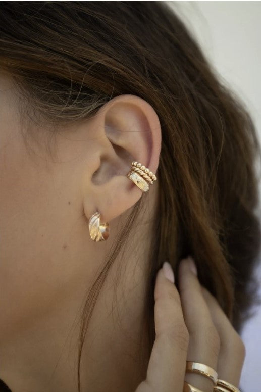 No piercing necessary with this gem! This rope ear cuff is the perfect way to glam up any look, or stack a few of them for some extra edge. Shown here with our Orb Ear Cuff.  Gold filled Handmade in Costa Mesa, CA
