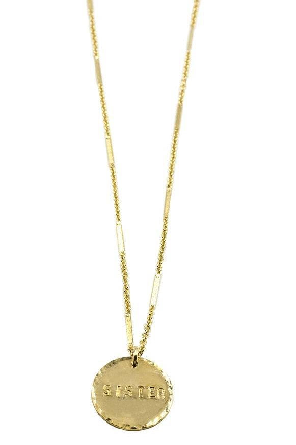 Whether they're your best friend or your actual sister, this precious coin necklace will definitely show that special someone how you feel! Or snag it for yourself, we don't judge. 14K Gold Filled 16" Chain with 2" Extender Coin is 5/8" in diameter Handmade and handstamped in Costa Mesa, CA. Sister engraved on coin. 