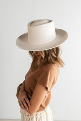 Things are looking up. The Ty is a tall telescope crown with an upturned brim made for versatility, you can customize with any band.  100% Australian Wool Stiff Wide Brim Fedora Style Dimensions: Crown - 11 cm, Brim - 9 cm  